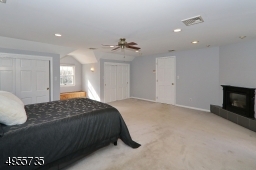 Master bedroom featuring gas fireplace