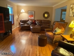 Spacious living room with gleaming hard wood floors