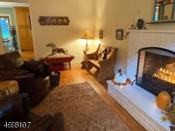 Family Room with fire place and hardwood floors