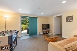 Located in lower level with sliders to beautiful patio, backyard
