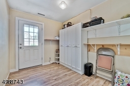 This bedroom is currently used for storage and provides access to the beautiful back yard.