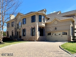 direct access two car garage and a driveway with four car capacity