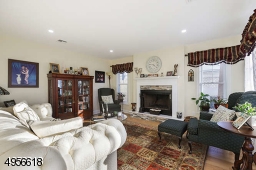 with fireplace, hardwood floor