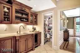 Fabulous Butler's Pantry complete with sink, dishwasher and wine refrigerator. Can you see the full pantry closet in this room?