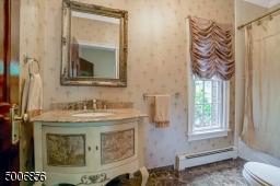 Classic looking  full bathroom, 1 full and 1 half bathroom on the first floor.