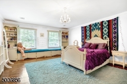 This bedroom has beautiful built-ins and look at that window seat!  Also there is a full bath with tub.