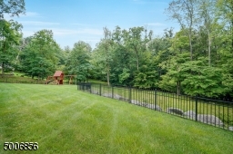 Enjoy this private open back yard that backs up to woods.