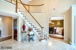 WOW! Soaring ceilings, and a stunning stone flooring.