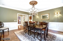 This 16X16 foot dining room is great for entertaining guests.  I love the molding details. It also flows to the kitchen and Butler's Pantry.