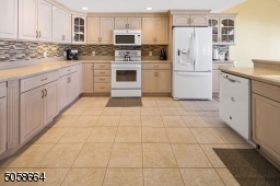 Large Eat In Kitchen with Plenty of Counters and Cabinets