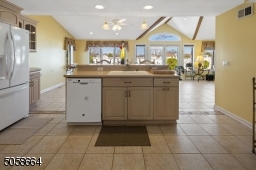 Center Island with Sink and Breakfast Bar Space