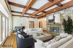 There is an entire wall of windows that overlooks the patio and the beautifully landscaped backyard. And of course, the pool! Virtual Staged.