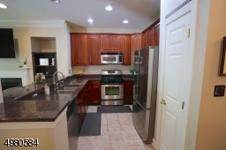 Your kitchen is complete with stainless appliances, granite countertops, a self-cleaning oven, garbage disposal and pantry.