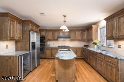 2 ranges gas & electric. Viking wine cooler, range & hood.