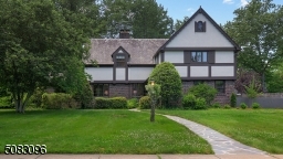 Majestic Tudor set back amid one-half acre property