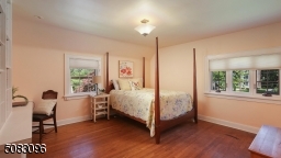 Spacious bedroom with built-in desk and bookcases