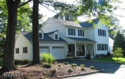 Pristine 4BR 3FB custom Colonial home located in desirable Laurel Park - just blocks from NYC train, bus & school.