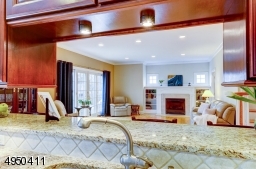 Enjoy access to breakfast bar & view of Great Room from over sink area of Kitchen!