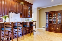 Breakfast bar and adjacent area offer casual dining and are open to the Great Room.