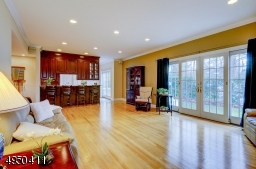 Sliding doors both in Kitchen and French sliding doors in the Great Room open to large paver Patio and private setting.