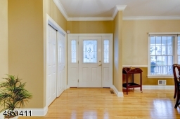 Gracious entry foyer.  Wood floor, double guest closet.
