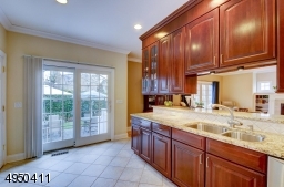 Top of the line appliances include Viking refrig, with custom cabinetry doors, double drawer Fisher & Paykel brushed stainless steel dishwasher, built-in KitchenAid microwave & oven combination w/convection. Fisher & Paykel stainless steel gas cooktop.
