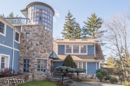 Located on 1.5 acres of wooded land on cul-de-sac in desirable Pine Way Farms, this nearly 8000 sq ft home sits high above the long welcoming driveway w/ utmost privacy & grandeur.
