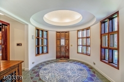 Step inside this unique foyer and let the magic of this impressive home unfold!