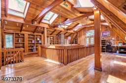 Venture up the spiral staircase to the 2nd level of the library.  It is ideal for a home office and quiet retreat, or whatever you choose.  And when you open the door, you will discover that you've just entered the MBR dressing area!