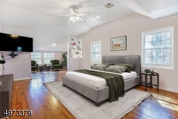 Master bedroom is not only spacious, but offers its own suite of additional spaces to retreat to.  There are 2 dressing areas, a silo that leads to the rooftop deck, and a private entrance into the 2nd-level of the library! Virtually Staged.