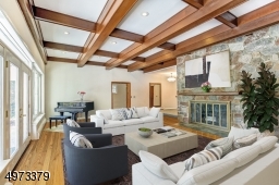 There is an entire wall of windows that overlooks the patio and the beautifully landscaped backyard.  And of course, the pool! Virtual Staged.