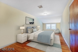 Here is one of the bedrooms with a view to the backyard.  Large walk in closet. Virtually Staged.