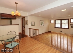 Step down to the family room with recessed lighting.