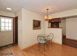 Have a cup of coffee or dinner in this open area off of the kitchen and family room.