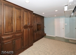 Off of den is a utility room with washer,dryer,furnace, commode, sink and access to crawl space.