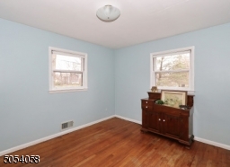 Second bedroom . hardwood floors and freshly painted.