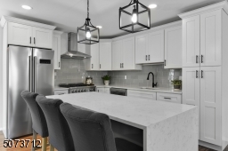 Stylish white cabinets with pantry.
