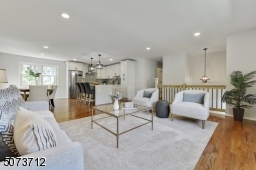 Open concept, wood flooring, recessed lights with dimmer.