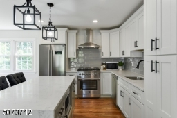 Glass tiled backsplash.