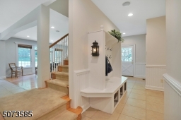 As you enter from the three-car garage, you have two large closets, built-in lockers with a bench, and a large laundry room.