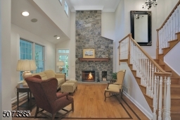 Your guest will notice the high ceilings, mahogany inlay floors, stone wood-burning fireplace and views overlooking the porch.