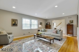 A welcoming living room with wood burning fireplace warms your heart.
