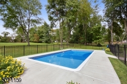 This fenced-in pool has a new liner, all new decking and new pool pump equipment.  You're all set for next season!