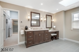 Dual vanities, oversized shower with multiple sprays, radiant heated floors