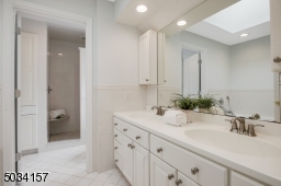 Dial vanities, jetted soaking tub, separate shower