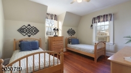 Bedroom #3 offers gorgeous hardwood floors, ceiling fan, high ceilings and bonus study room.