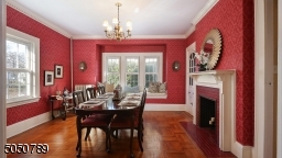 Banquet size Dining Room with Gorgeous Window Seat, Hardwood Floors and crown molding