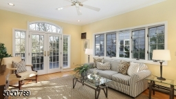 Natural Light streams through gorgeous windows in this fabulous family room with access to Deck & yard