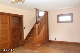 Beautiful woodwork on staircase leading to 2nd floor