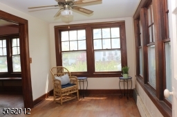 Windows on 2 sides providing lots of natural light in this room.  Can be Family Room, home office, or Sun Room.  Features hardwood floors, ceiling fan